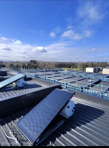 Solar panels installed on a large commercial metal roof